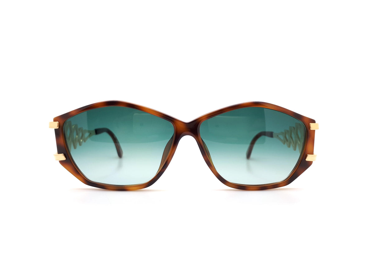Paloma Picasso sunglasses with green lenses