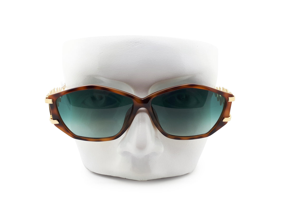 Paloma Picasso sunglasses with green lenses