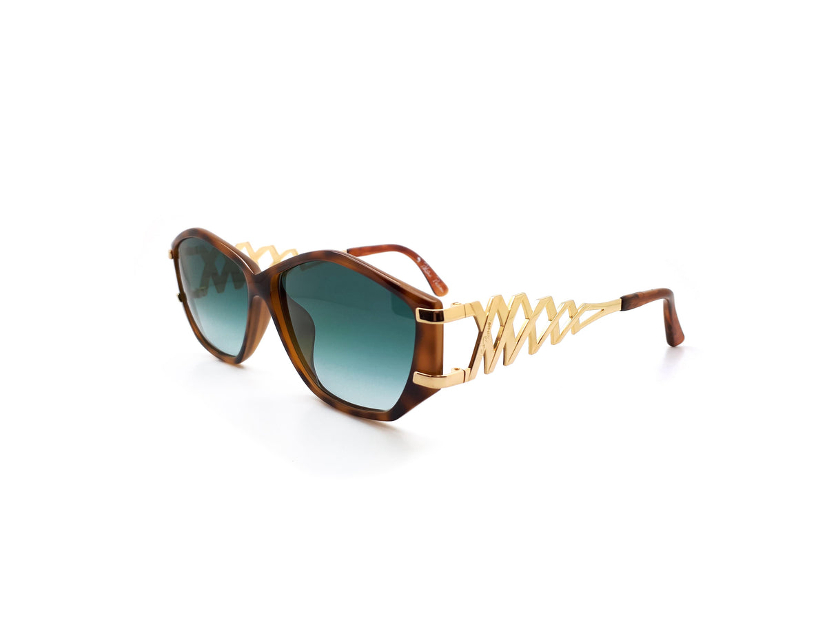 Paloma Picasso sunglasses with green lenses