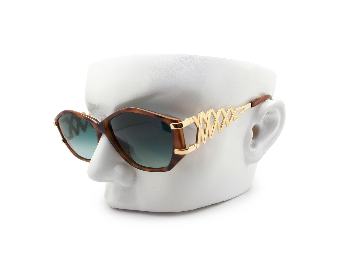 Paloma Picasso sunglasses with green lenses