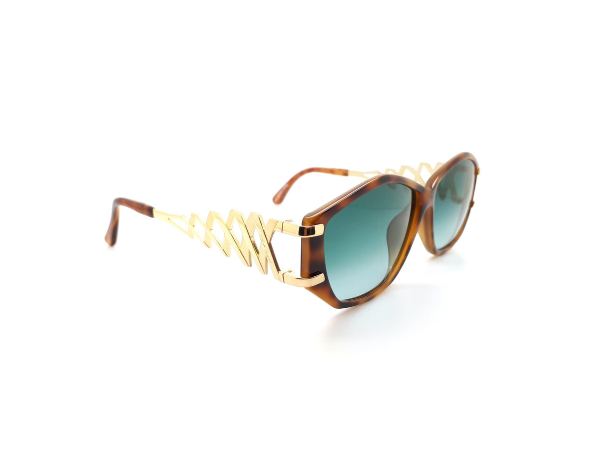 Paloma Picasso sunglasses with green lenses