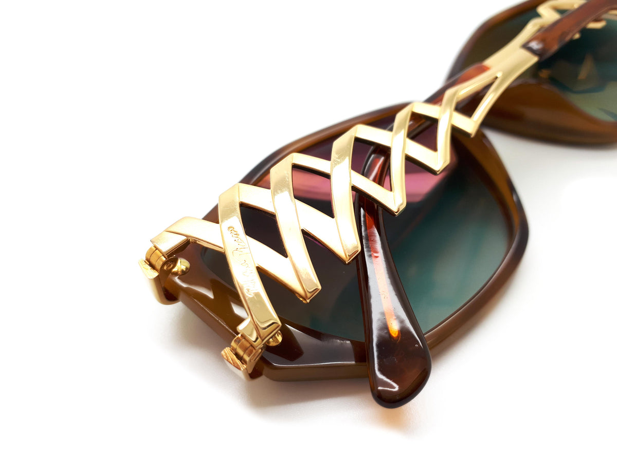 Paloma Picasso sunglasses with green lenses